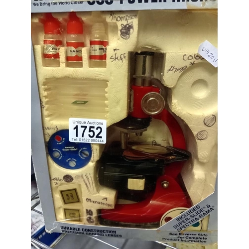 1752 - A boxed Tasco 900 power microscope