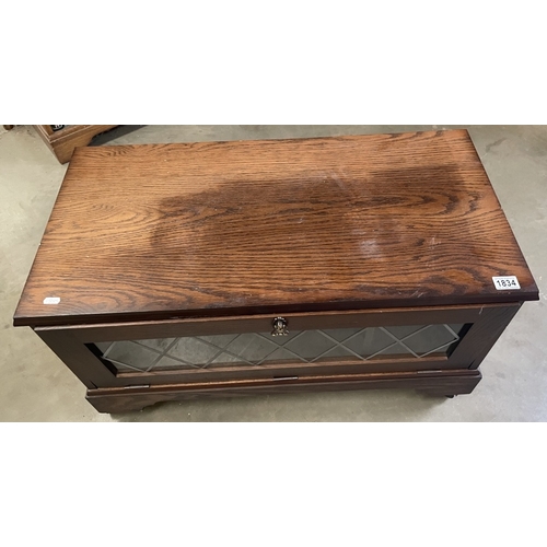 1834 - A glass front TV stand COLLECT ONLY