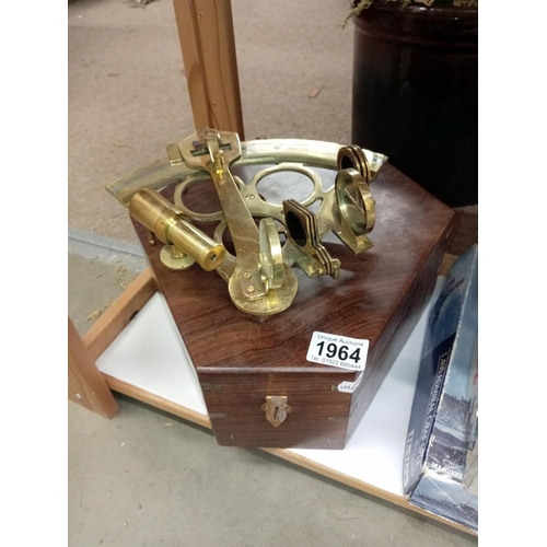 1964 - A brass sextant in hard wood box (missing 1 mirror)