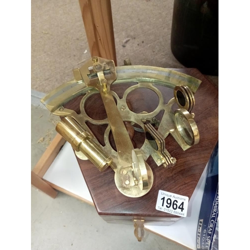 1964 - A brass sextant in hard wood box (missing 1 mirror)