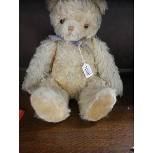 1609 - An old straw filled Teddy bear with growler.