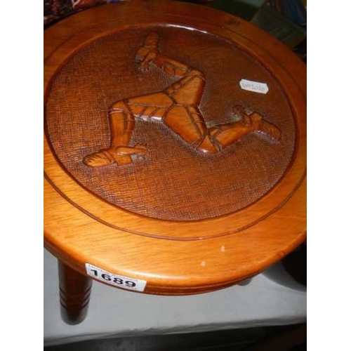 1689 - A three legged stool with Isle of Man three legged motif carved in the top. COLLECT ONLY.