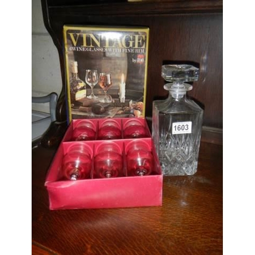 1603 - A mid 20th century cut glass decanter and a boxed set of six glasses.