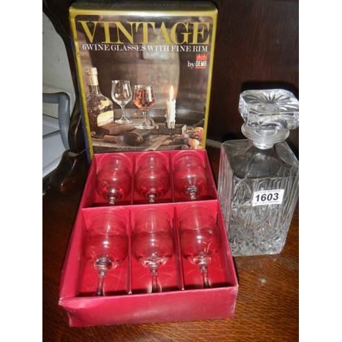 1603 - A mid 20th century cut glass decanter and a boxed set of six glasses.