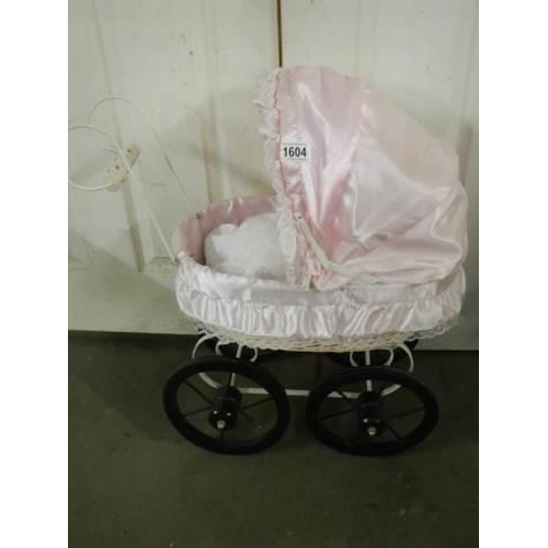 1604 - A late 20th century replica dolls pram with doll. COLLECT ONLY.