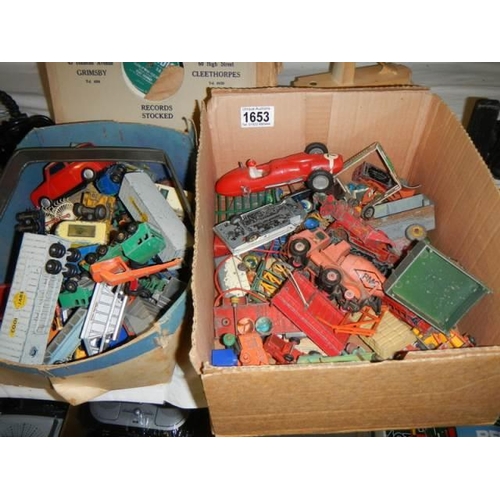 1653 - A good lot of play worn die cast cars etc., in two trays.