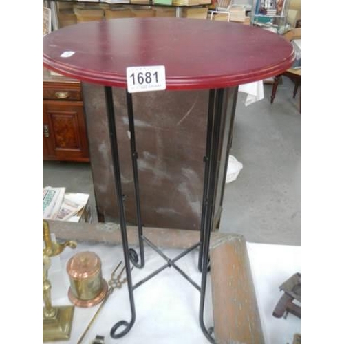 1681 - A circular metal side table with mahogany top, COLLECT ONLY.