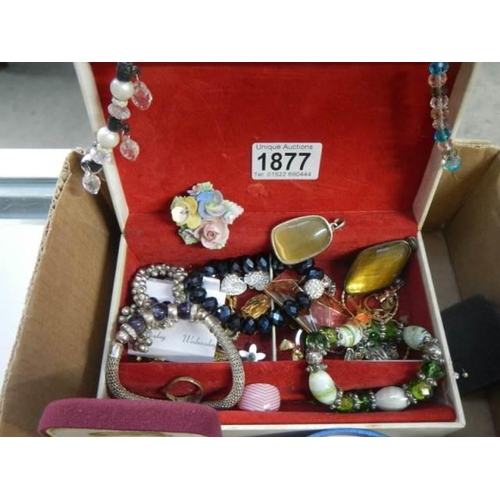 1877 - A good mixed lot of costume jewelry including brooches, bangles etc.,