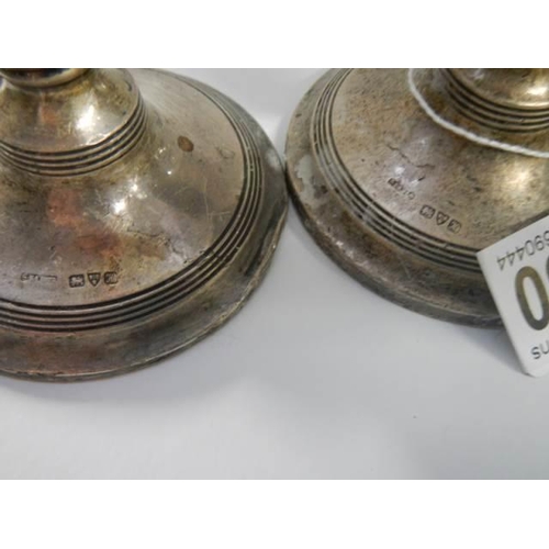 1880 - A pair of small silver candlesticks.