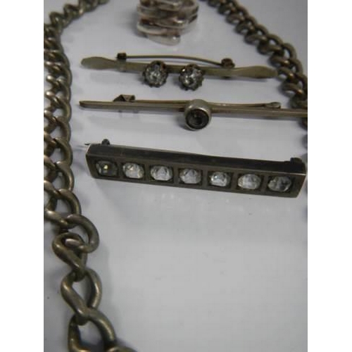 1883 - A silver chain, silver ring and three brooches.