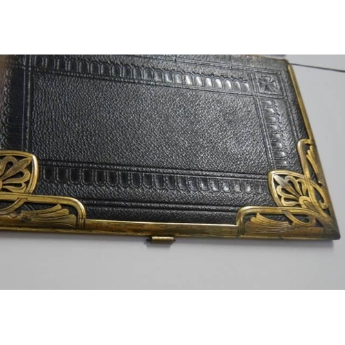 1890 - A front and back Victorian book cover with brass fittings.