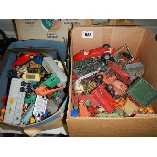 1653 - A good lot of play worn die cast cars etc., in two trays.