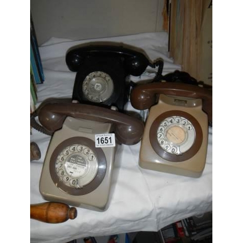 1651 - Three old telephones.