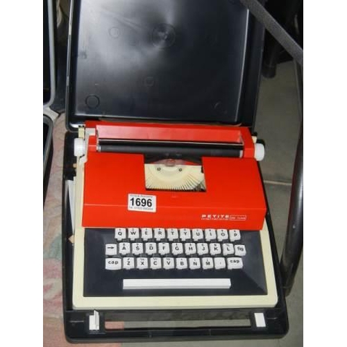 1696 - A good cased Petite portable typewriter.