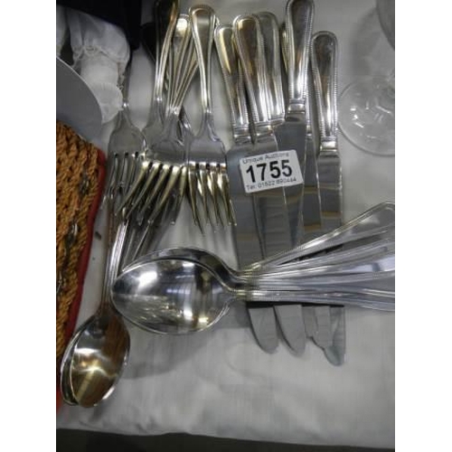 1755 - A set of six knives, forks, dessert spoons and teaspoons (new).