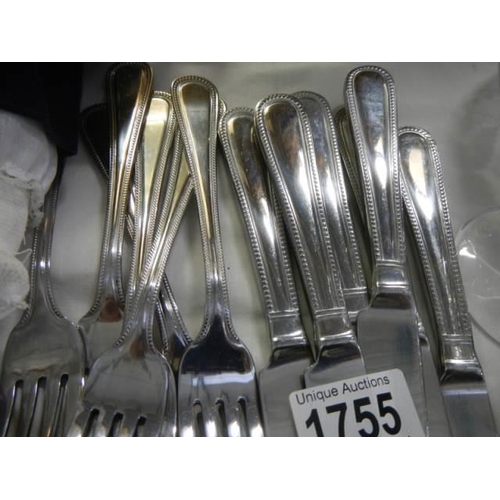 1755 - A set of six knives, forks, dessert spoons and teaspoons (new).