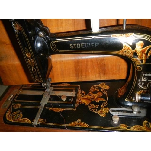 1764 - A cased vintage Stoener sewing machine.