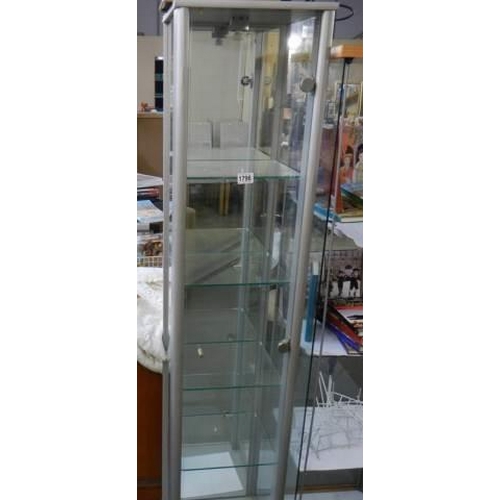 1796 - A good glass display cabinet with four shelves and door,. COLLECT ONLY.