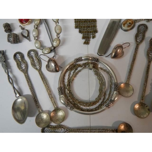 1895 - A mixed lot including brooches, spoons etc.,