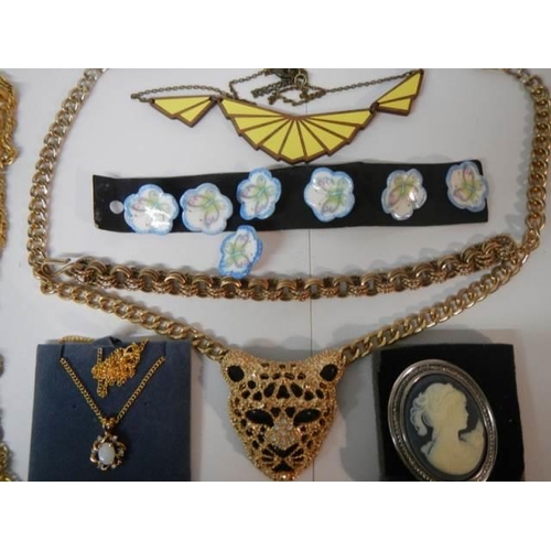 1899 - A leopard necklace, set of buttons, necklaces etc.,