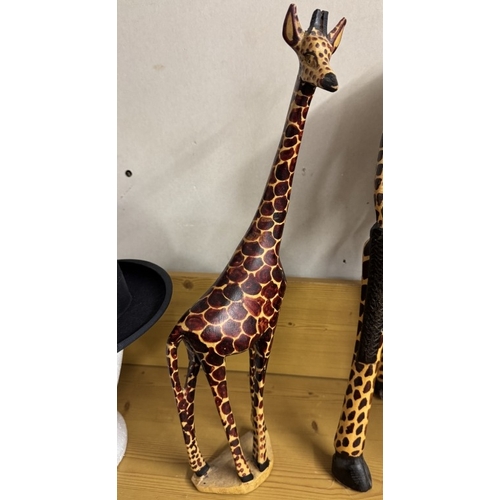 1606 - 2 realistic carved wooden giraffes, height 90cm & 44cm