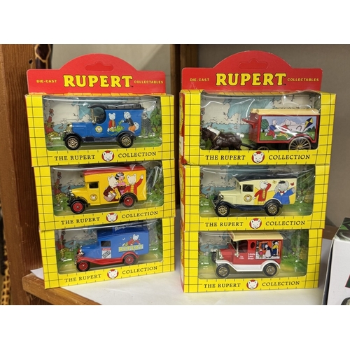 1613 - A set of 12 Rupert The Bear boxed die cast vehicles & a boxed Eddie Stobart lorry