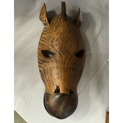 1647 - A quantity of wooden masks etc.