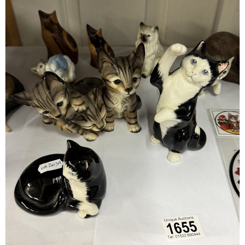 1655 - A quantity of cats including a calendar, plate & window art