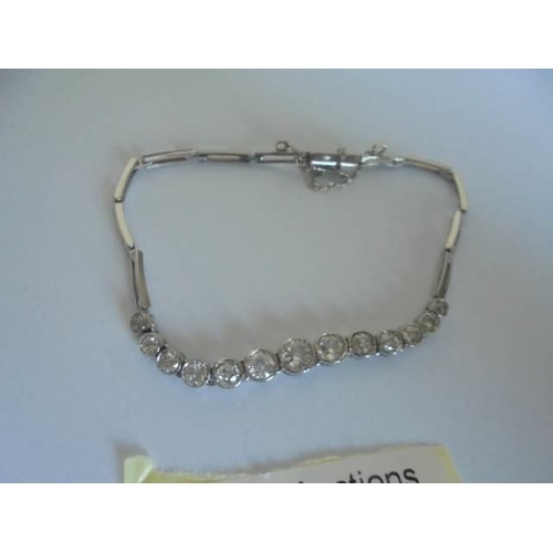 13 - A three carat plus 18ct white gold diamond bracelet, 7.49 grams.