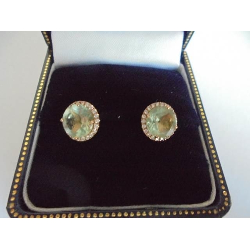 3 - A pair of 18ct gold and aquamarine earrings. 2.35 grams