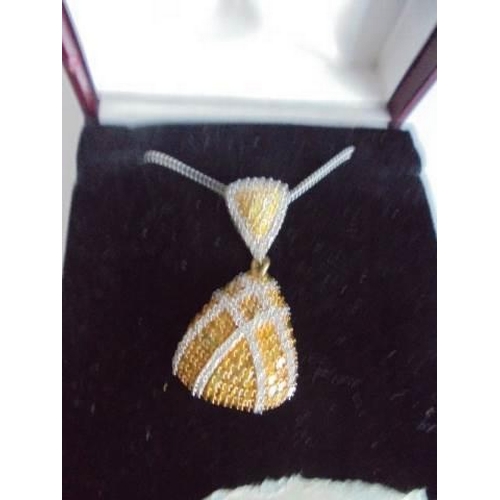 4 - A 9ct gold double diamond pendant on a 9ct chain, 3.99 grams