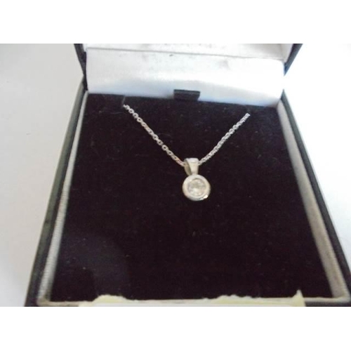 8 - A 9ct gold chain with quarter carat solitaire diamond pendant, 1.95 grams.