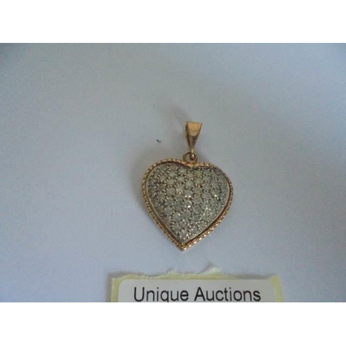 9 - An approximately 3 carat diamond heart set in two tone gold, 7.19 grams.