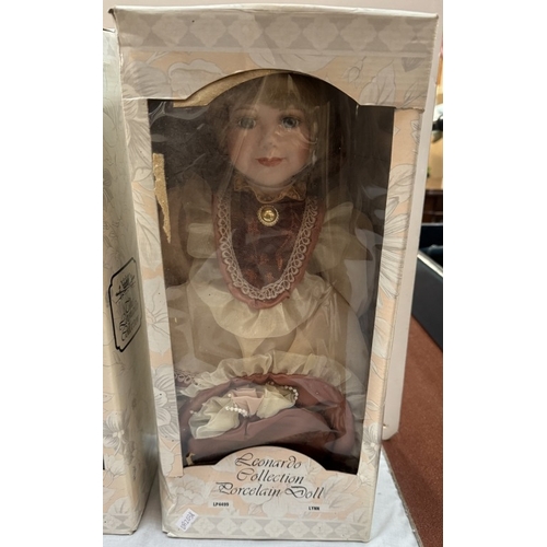 1707 - 3 boxed porcelain headed collectors dolls