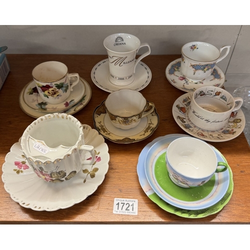 1721 - A large early 20th century moustache cup & saucer & 4 cups & saucers