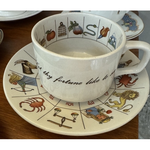 1721 - A large early 20th century moustache cup & saucer & 4 cups & saucers