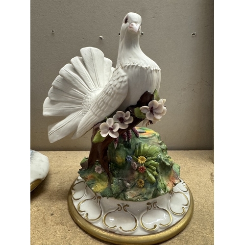 1738 - A continental ceramic dove lamp base (no filling) & a seated figurine