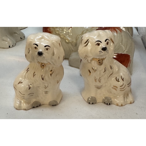 1749 - A pair of Royal Doulton Staffordshire dogs & 4 odd dogs