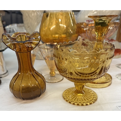 1750 - A quantity of vintage amber glass including brandy glass & candlestick etc.