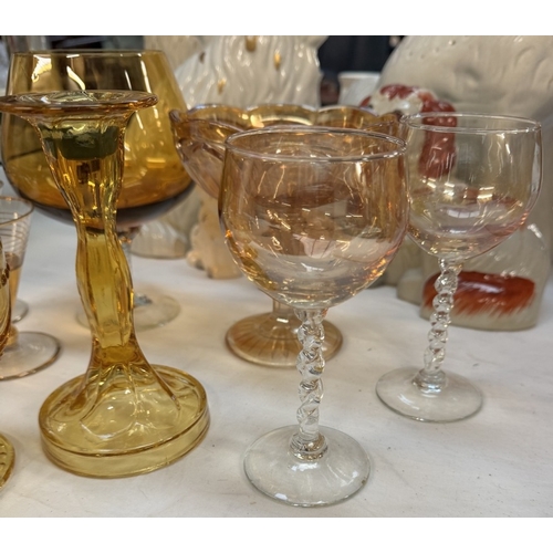 1750 - A quantity of vintage amber glass including brandy glass & candlestick etc.