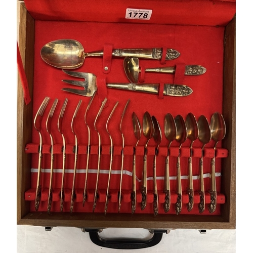 1778 - A cased Thailand gold plated canteen of cutlery