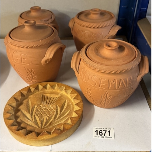 1671 - 4 terracotta storage jars carved and a wooden Buddha shortbread mould (1 A/F)