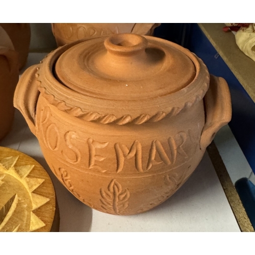 1671 - 4 terracotta storage jars carved and a wooden Buddha shortbread mould (1 A/F)