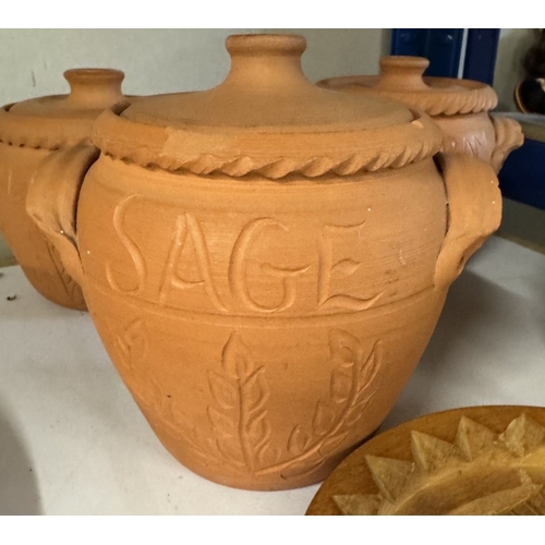 1671 - 4 terracotta storage jars carved and a wooden Buddha shortbread mould (1 A/F)