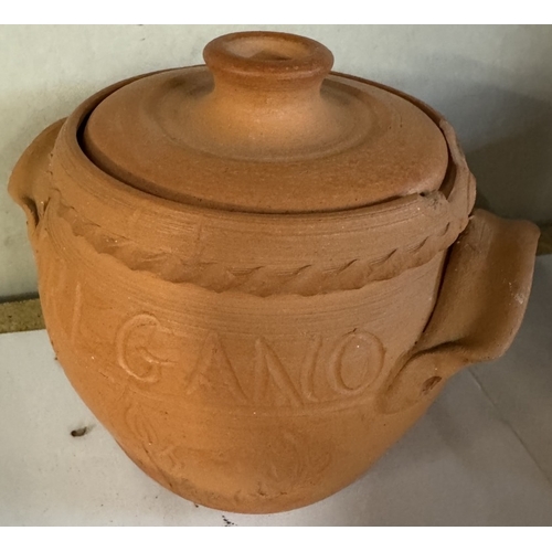 1671 - 4 terracotta storage jars carved and a wooden Buddha shortbread mould (1 A/F)