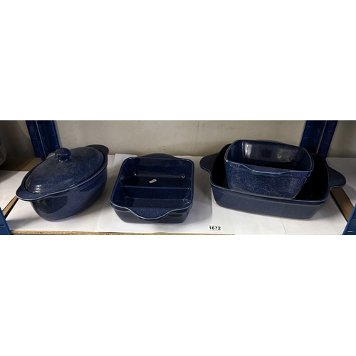 1672 - A quantity of  heavy blue glazed cookware including roasting pans