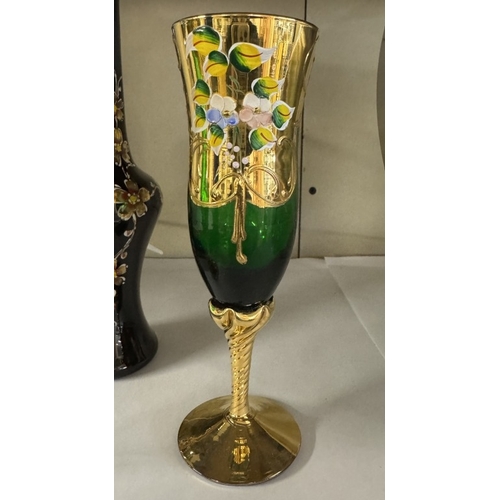 1675 - A pair of gilt & hand painted on green glass flute glasses & a vase of similar style