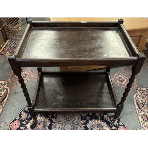 1853 - A 1930's oak tea trolley with barley twist legs