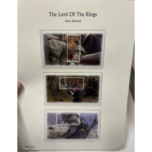 218 - 3 Games Workshop Lord of the Rings books & limited edition stamps