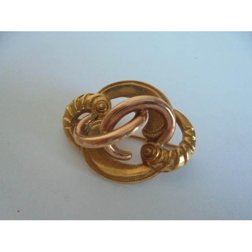 30 - A 9ct gold brooch (3.48 grams) and a yellow metal brooch.